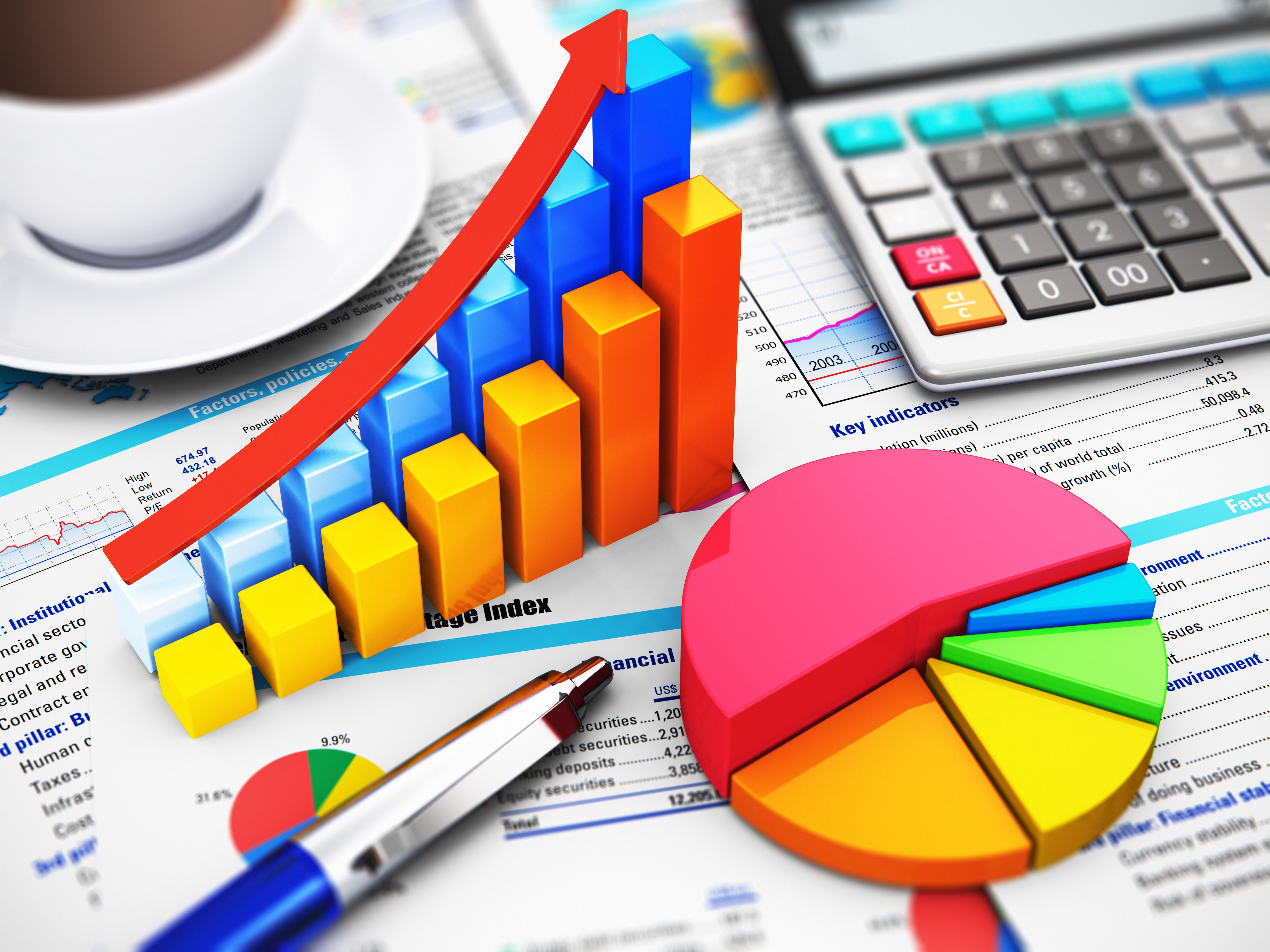 Business Finance, Tax, Accounting, Statistics And Analytic Research Concept: Macro View Of Office Electronic Calculator, Bar Graph Charts, Pie Diagram And Ballpoint Pen On Financial Reports With Colorful Data With Selective Focus Effect